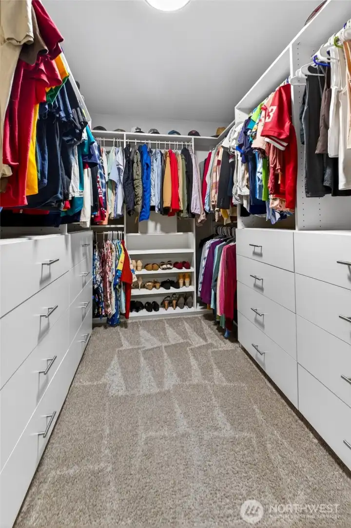 Lots of hanging and custom cabinet storage