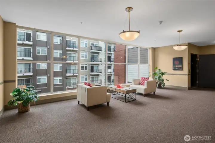 Fourth floor lounge area just down the hall from unit near the elevator. Fourth floor lounge area just down the hall from unit near the elevator.