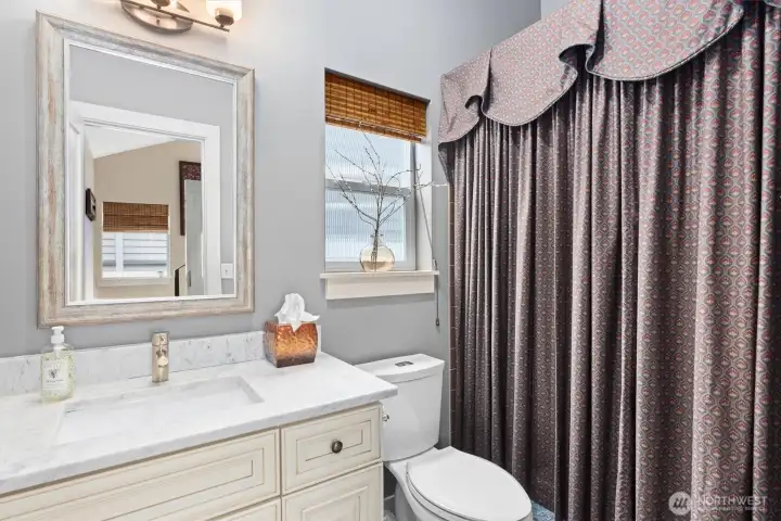 Full bath...one of the three and one-half baths that adorn the home