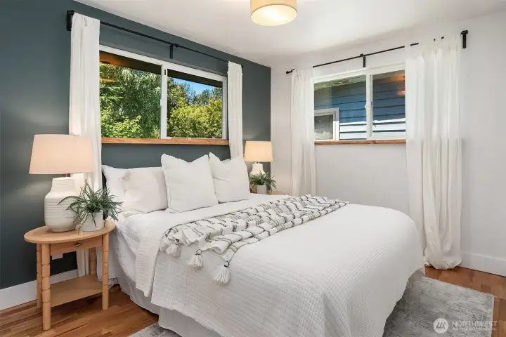 Versatile second bedroom on the main level, ideal for guests, a home office, or additional living space.