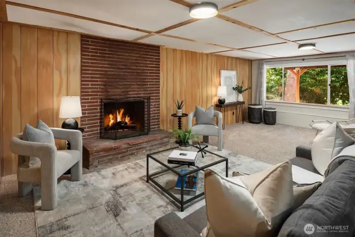 Imagine cozy evenings gathered around the fireplace in the spacious lower-level entertaining area—the perfect place to relax, host guests, or enjoy movie nights with family and friends.