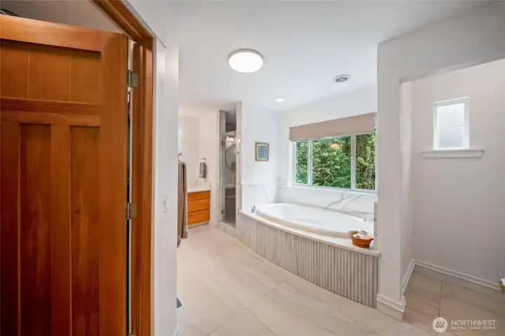 Generous primary ensuite bath has been completely remodeled with handsome choices Generous primary ensuite bath has been completely remodeled with handsome choices