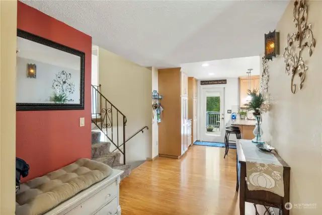 Spacious foyer with hardwood floors and a side light for added light. Entry coat closet.