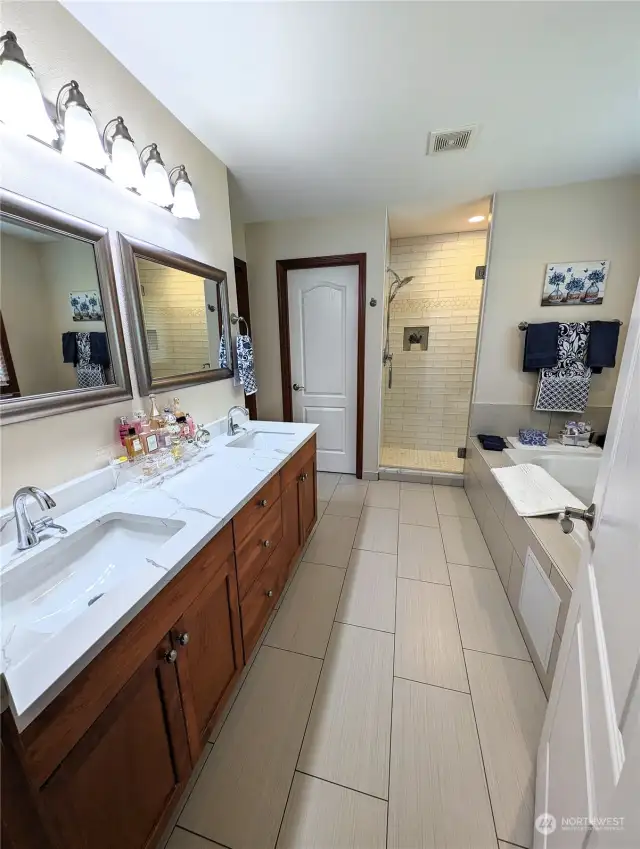 Fully updated 5 piece Primary Bathroom. Double undermount sinks, new flooring, counters, custom tile...