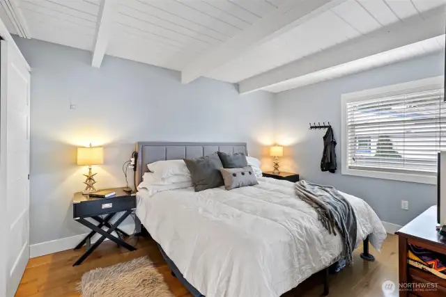 The main level bedroom is a great size. The primary bedroom is on the lower level in this home.