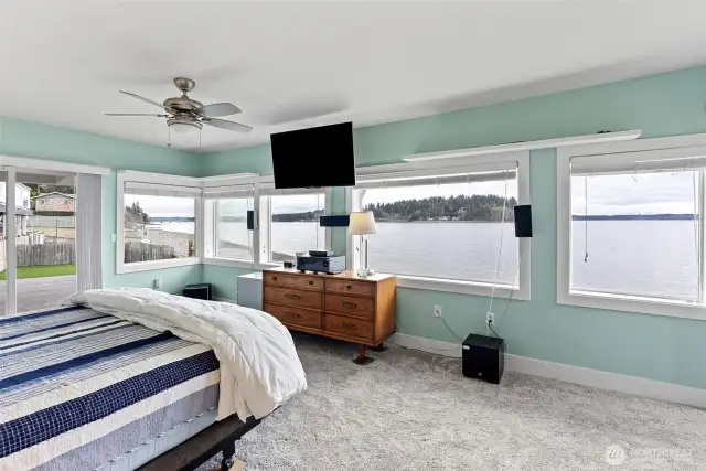 The primary bedroom is nestled on the lower level and enjoys expansive marine views on the daily.