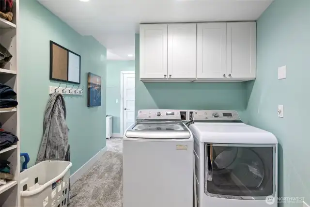 The washer and dryer remain with the home and are located in the primary bedroom's walk-in closet.