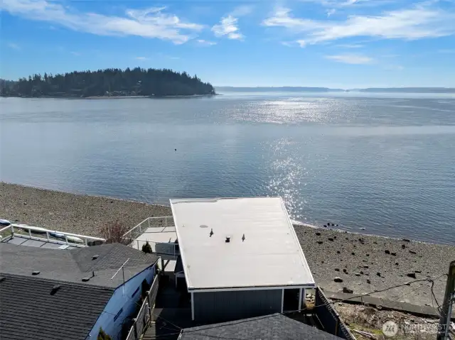 An aerial view of this cottage with 2-car garage and 1310 sq. ft. of living space.