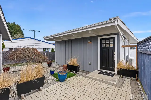 You will be immediately captivated by this home's charm and ambiance. A 400 sq. ft. 2-car garage is just to the left of this picture.