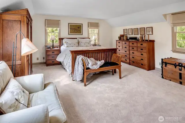 Primary suite with generous walk-in closet, 3/4 bath and tons of windows