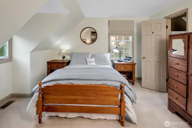 Generous size bedroom in the MIL apartment with a 3/4 bath, lots of windows creates a light filled ambiance