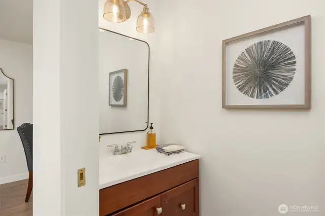 Convenient guest bathroom tucked away on the main level