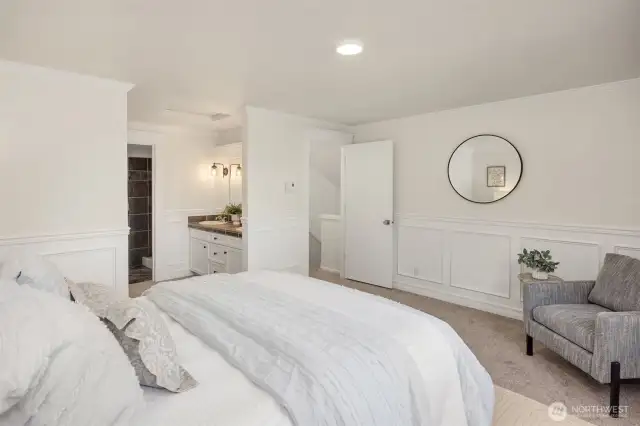 Primary bedroom features walk-in closet, dual vanity, shower, and soaking tub