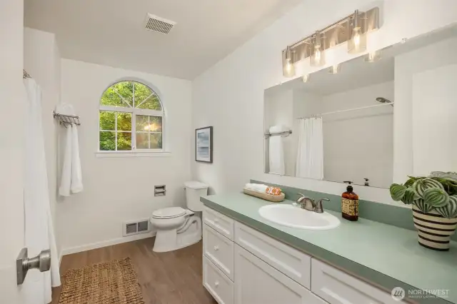 Spacious shared upper level bathroom with shower/tub combo