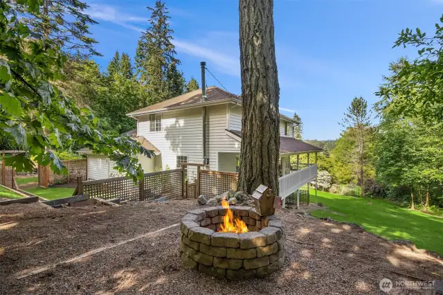 Additional fire pit area overlooks the lawn below