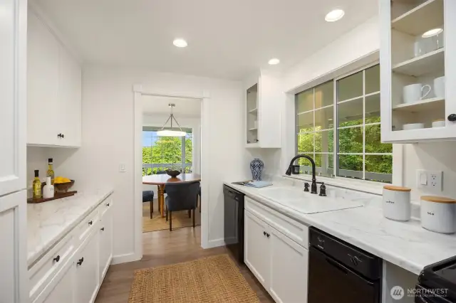 New counters and a new built-in microwave in the kitchen which overlooks the wrap-around deck and yard