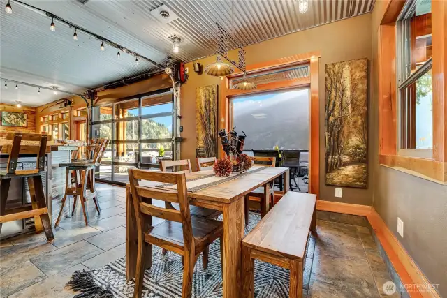 Downstairs to the dining room, kitchen, bar and family room.