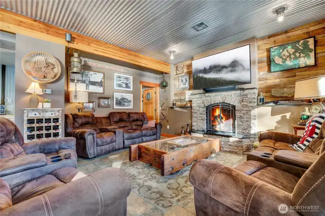 Welcoming gas fireplace with 1/2 bath beyond.