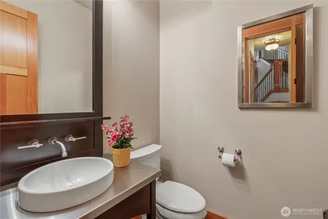 Powder bath conveniently located off garage and great room...