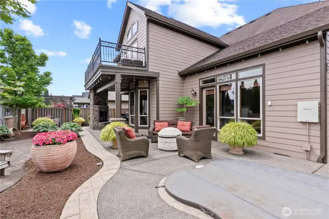 Simply stunning grounds! Aggregate concrete, stamped borders, beautifully landscaped and meticulously kept. Inground hot tub/spa (w/cover), outdoor space offers multiple spots to retreat and enjoy!