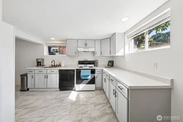 Fully functioning kitchen with tons of storage! Look at all that light that comes in too!