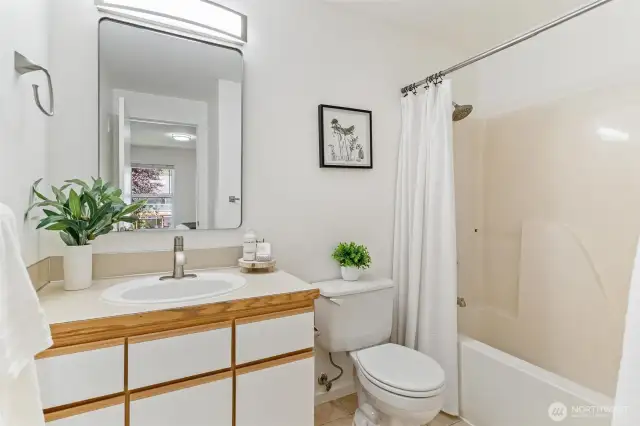 Primary bathroom with new mirror, light fixture and heat lamp