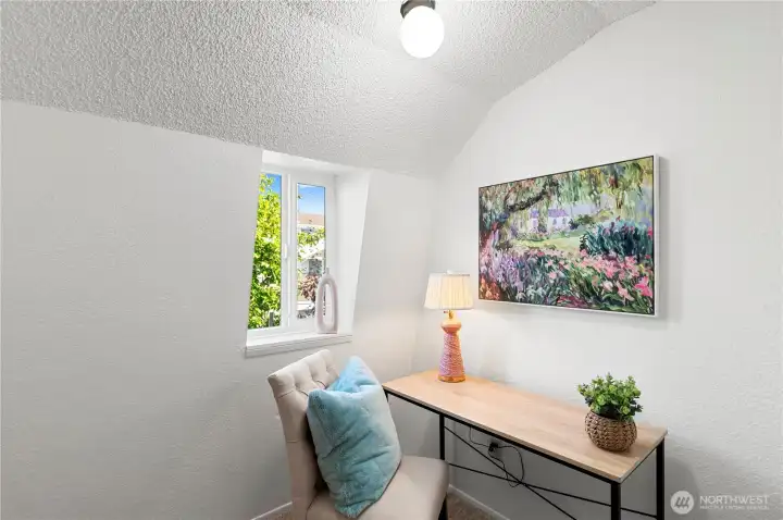 Dedicated office space with a view of the garden.