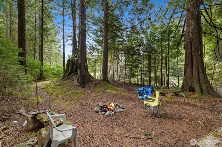 A private trail leads you to your very own campsite, river in the background