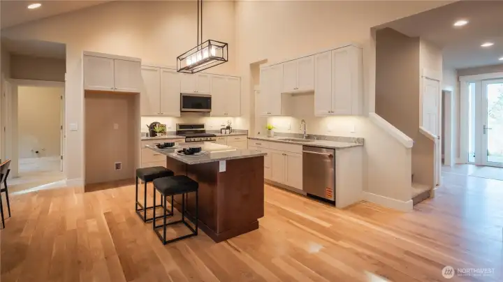 From the moment you step inside, you’re welcomed by a clean, open layout that leads directly into the kitchen and main living space. The sightlines create an immediate sense of connection and functionality, ideal for both everyday living and hosting guests.