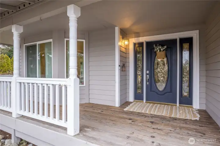 Large covered porch includes a gate on the left side for easy access to and from the back yard