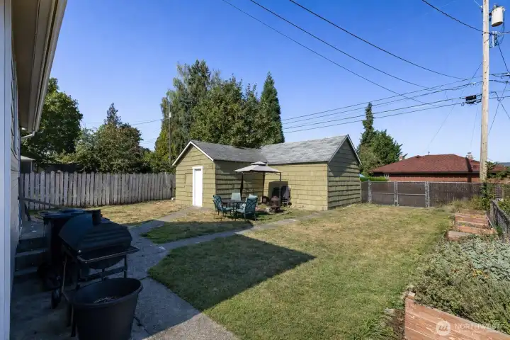 Detached Garage + Shop and Alley Access provide potential DADU opportunity. Great backyard space to entertain, play, and have a garden space!