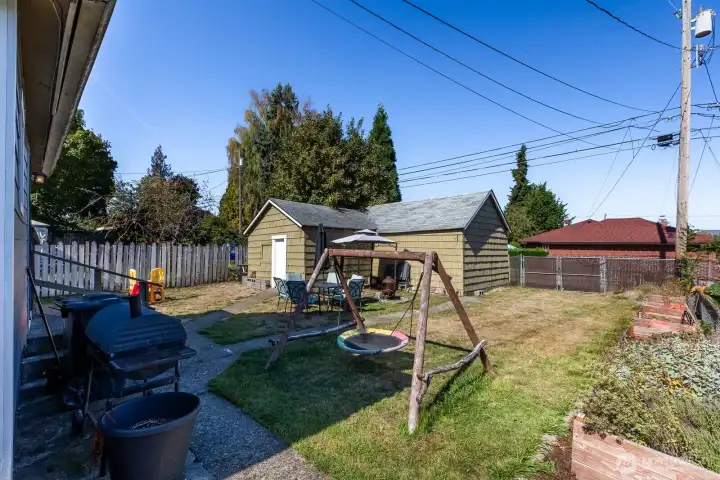 Detached Garage + Shop and Alley Access provide potential DADU opportunity. Great backyard space to entertain, play, and have a garden space!