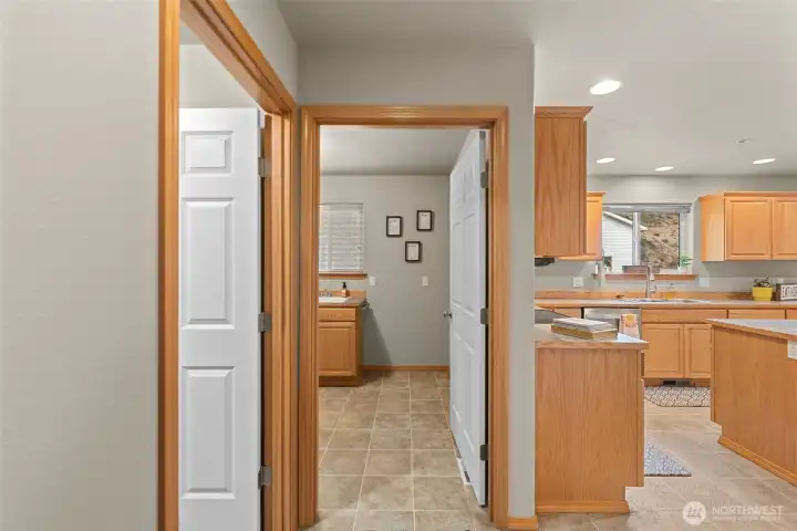 Coming from garage (L) utility room. Straight is laundry and 1/2 bath