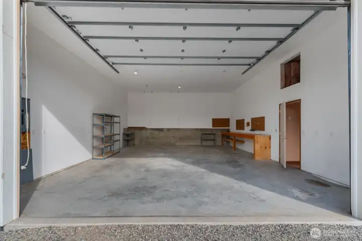 30 Feet deep by 24 feet wide. 11ft garage door