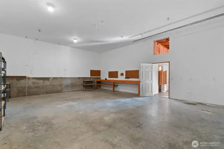 30 Feet deep by 24 feet wide.  11ft garage door