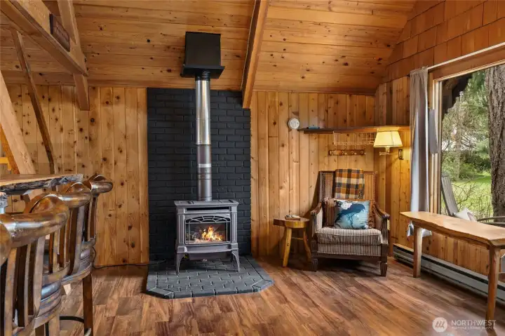 Cozy propane stove anchors the great room.