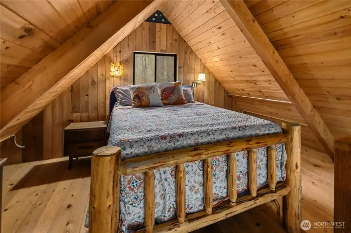 Cozy loft sleeping space with classic cabin feel.