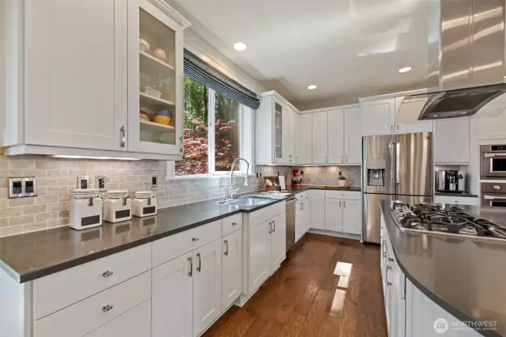 Quartz countertops for easy maintenance and lots of cabinetry.