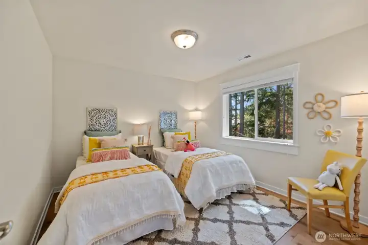 First of the three secondary bedrooms upstairs. Hardwood floor throughout this level as well. Upgrade completed by the current owners.