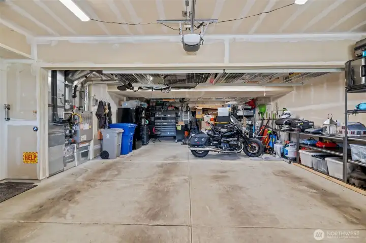 Unique X-large garage! 4-car garage and tons of storage! HVAC serviced in 2026. Generator and 2 EV chargers!