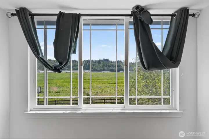 View of farmland from primary bedroom