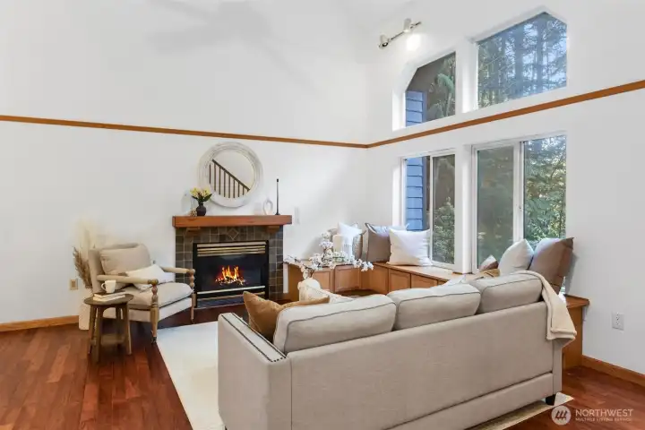Living Room with vaulted ceilings and HUGE windows with window seat
