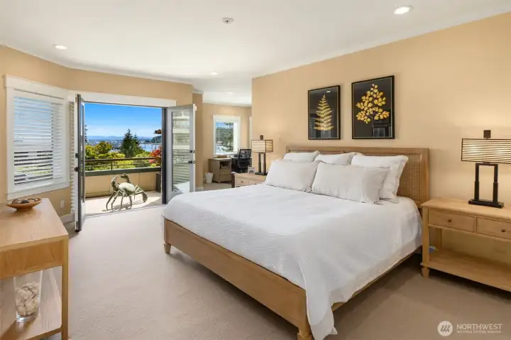 The Primary with access to the deck and captivating views.