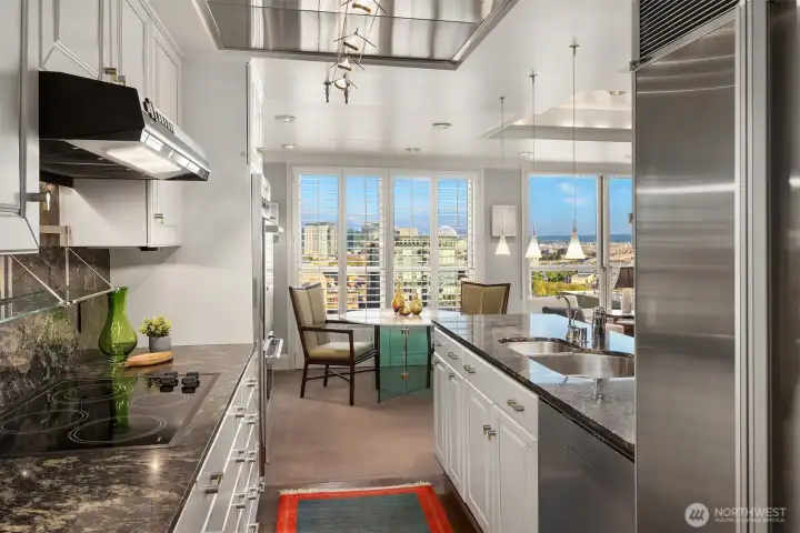 Updated and spacious kitchen with quality appliances, subzero refrigerator, custom cabinets & hardware.