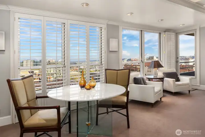 Abundant windows and dual balconies showcase impressive views, framing Mt. Rainier & the Puget Sound from all rooms.