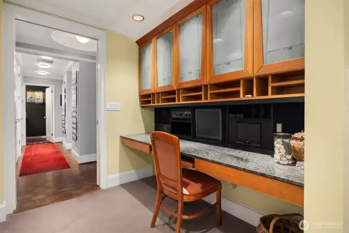 Part of the office and primary suite access, door closes off creating private primary retreat and home office.  This space hosts the Yamaha Home Theater System.