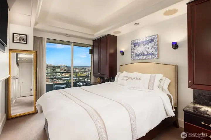 Owners suite located at the West end of the home- offers separate sleeping space with lovely views, private balcony access, private ensuite, abundant closets and storage in addition to custom builtins and independant home surround sound and theater options.