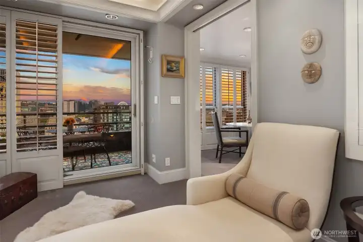 door to the right slides closed to provide a private secondary/guest suite with direct balcony access.