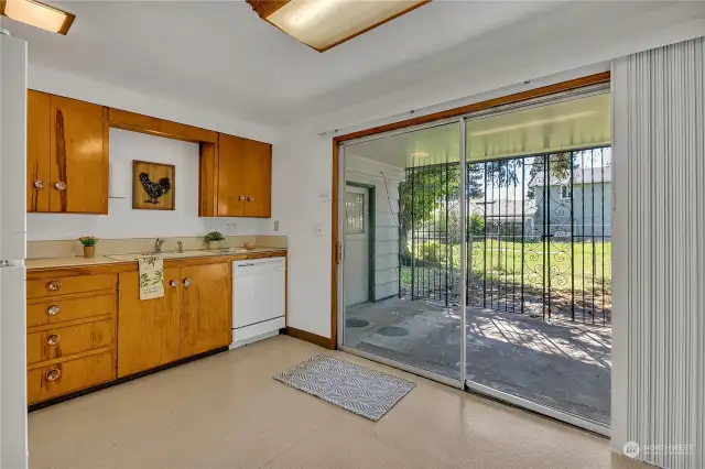 Kitchen features a wonderful large slider to covered patio and accesses fully fenced backyard