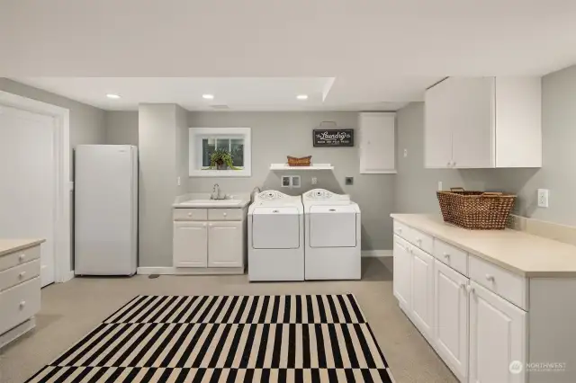 Dreamy laundry room with more storage, wrapping station. Utility room to the left with even more storage!